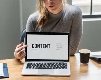 blond woman pointing laptop screen 53876 94709
